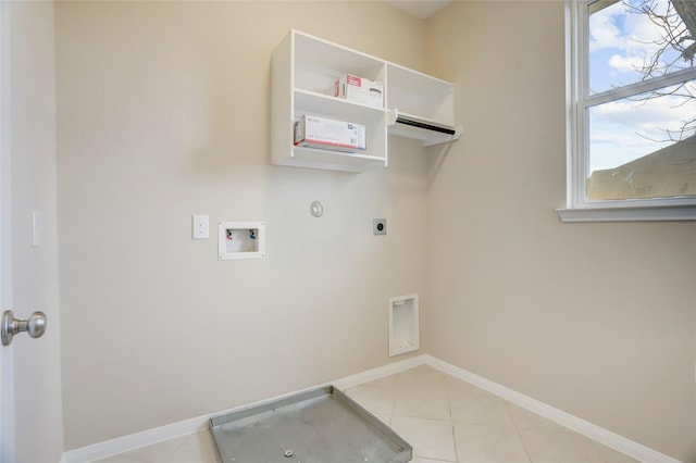 5402 Bending Branch Dr, Missouri City, TX 77459 - laundry room featuring electric dryer hookup, hookup for a washing machine, baseboards, light tile patterned floors, and hookup for a gas dryer