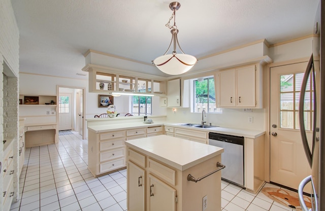 6119 Bankside Dr, Houston, TX 77096 - kitchen featuring stainless steel appliances, a sink, light tile patterned floors, light countertops, and ornamental molding