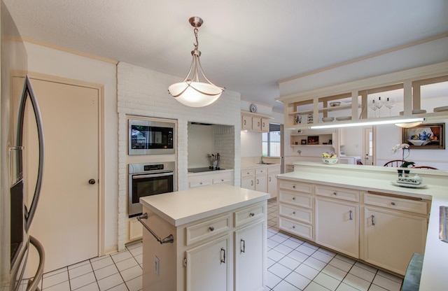 6119 Bankside Dr, Houston, TX 77096 - kitchen with black appliances, light tile patterned floors, light countertops, pendant lighting, and a center island