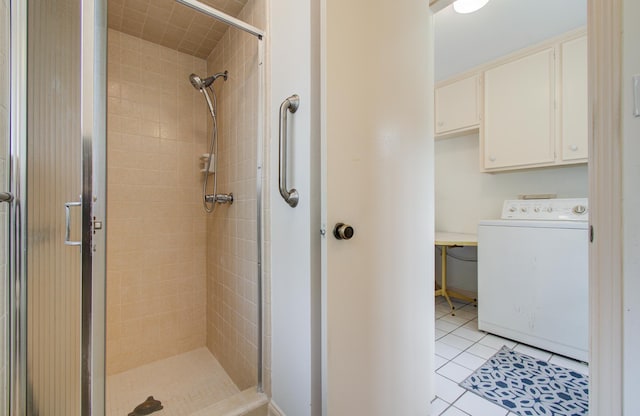 6119 Bankside Dr, Houston, TX 77096 - full bath featuring washer / dryer, a stall shower, and tile patterned floors