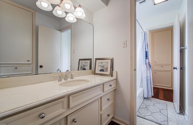 6119 Bankside Dr, Houston, TX 77096 - bathroom with vanity, a chandelier, and shower / bath combination with curtain