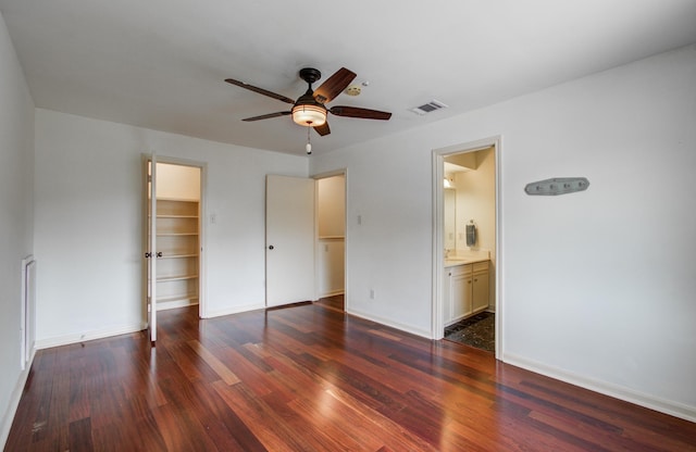 6119 Bankside Dr, Houston, TX 77096 - unfurnished bedroom featuring wood finished floors, a spacious closet, a closet, and baseboards