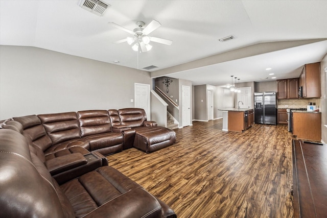 11203 Riata Canyon Dr, Cypress, TX 77433 - living room with dark wood finished floors, vaulted ceiling, stairs, and ceiling fan