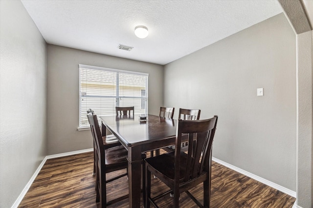11203 Riata Canyon Dr, Cypress, TX 77433 - dining space with baseboards, dark wood-style flooring, and arched walkways