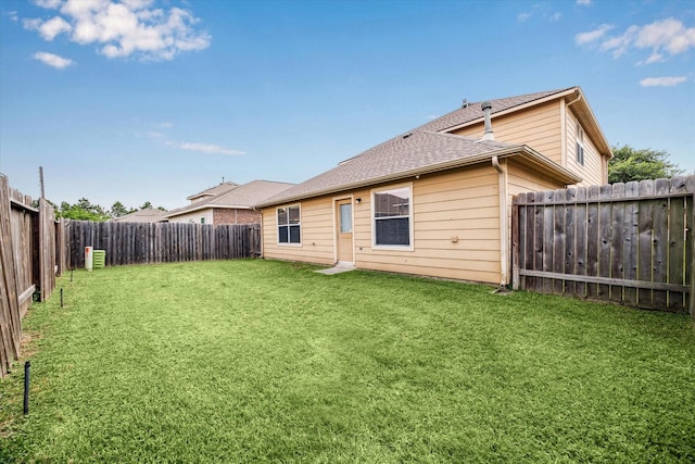 11203 Riata Canyon Dr, Cypress, TX 77433 - rear view of property with roof with shingles