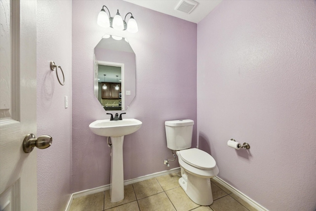 11203 Riata Canyon Dr, Cypress, TX 77433 - bathroom featuring tile patterned floors, toilet, and baseboards