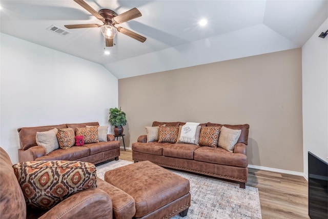 15007 Ashton Meadows Dr, New Caney, TX 77357 - living room featuring ceiling fan, light wood-style floors, baseboards, and vaulted ceiling