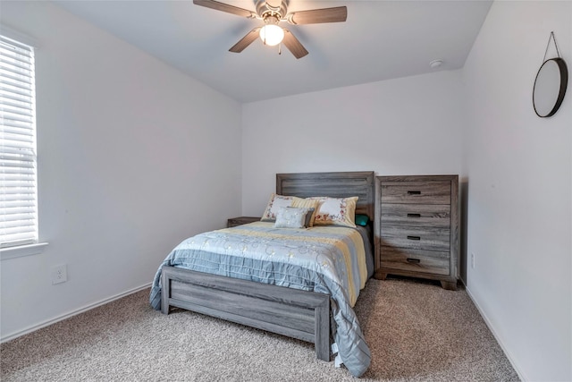 15007 Ashton Meadows Dr, New Caney, TX 77357 - bedroom with carpet flooring, a ceiling fan, and baseboards