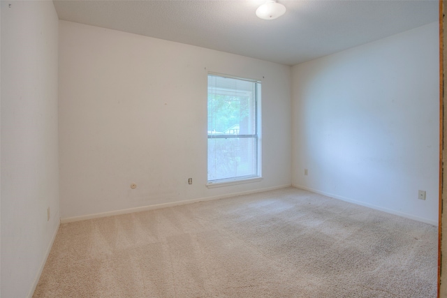 333 Hardy St, Huntsville, TX 77340 - empty room with carpet flooring and baseboards