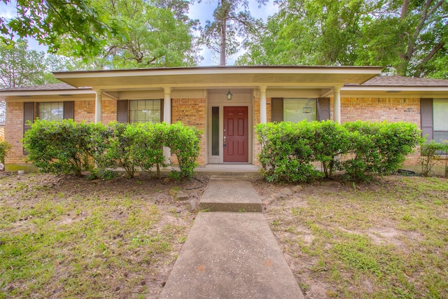 333 Hardy St, Huntsville, TX 77340 - ranch-style house featuring brick siding and covered porch