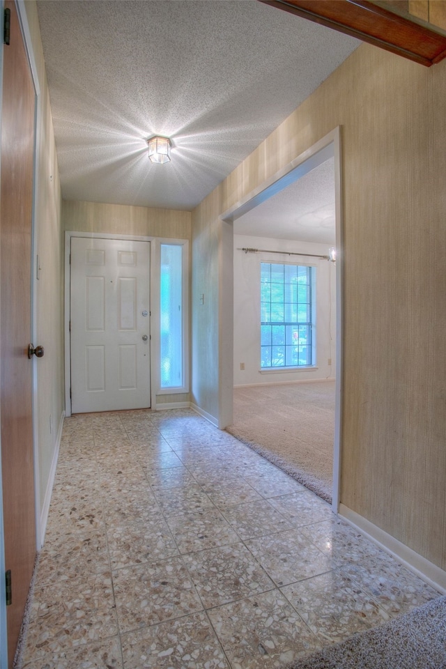 333 Hardy St, Huntsville, TX 77340 - entrance foyer featuring a textured ceiling and baseboards
