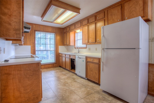 333 Hardy St, Huntsville, TX 77340 - kitchen featuring white appliances, a sink, and brown cabinetry