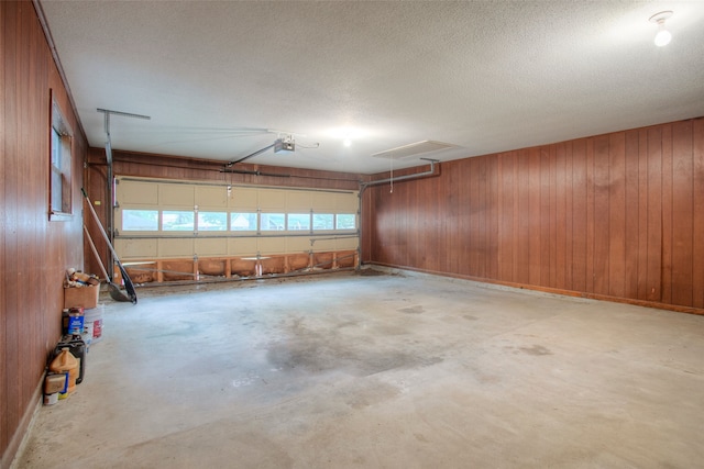 333 Hardy St, Huntsville, TX 77340 - garage with a garage door opener and wooden walls