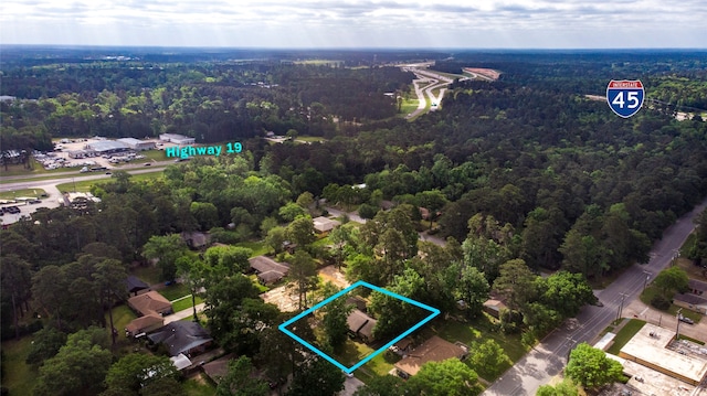 333 Hardy St, Huntsville, TX 77340 - aerial view of property and surrounding area featuring a heavily wooded area and property boundaries highlighted