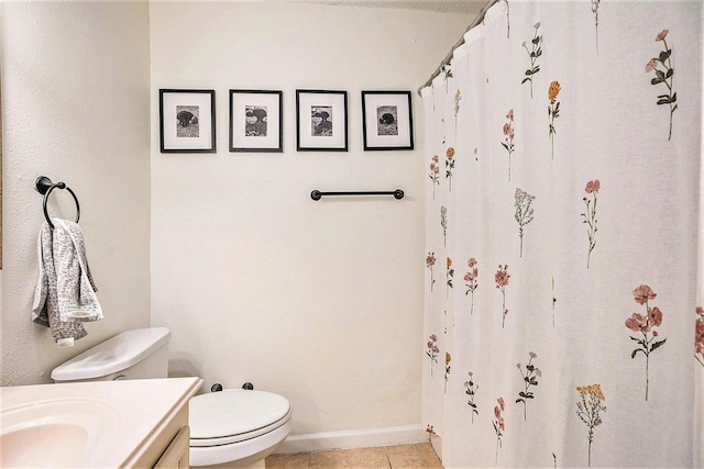 116 Whiting St, Galveston, TX 77550 - bathroom featuring toilet, vanity, tile patterned floors, baseboards, and curtained shower