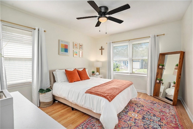 116 Whiting St, Galveston, TX 77550 - bedroom featuring light wood-style flooring, a ceiling fan, and baseboards