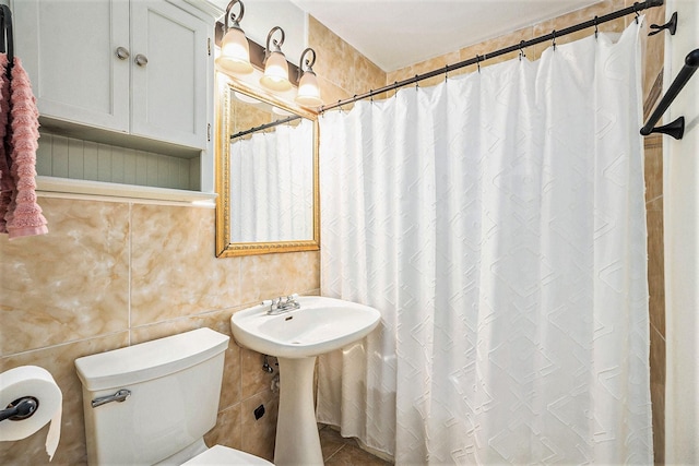 116 Whiting St, Galveston, TX 77550 - bathroom with toilet, a shower with shower curtain, and a sink
