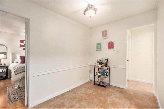 116 Whiting St, Galveston, TX 77550 - interior space featuring baseboards and a textured ceiling