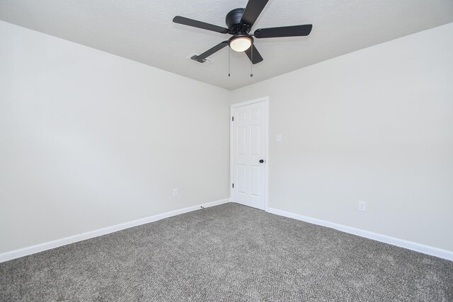 4618 Turf Valley Dr, Houston, TX 77084 - unfurnished room featuring a ceiling fan, dark carpet, and baseboards