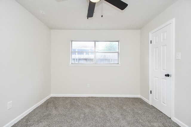 4618 Turf Valley Dr, Houston, TX 77084 - empty room with carpet floors, ceiling fan, and baseboards