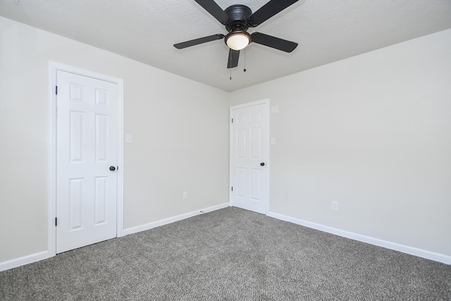 4618 Turf Valley Dr, Houston, TX 77084 - empty room with carpet floors, a ceiling fan, and baseboards
