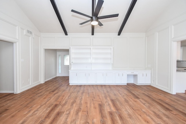 4618 Turf Valley Dr, Houston, TX 77084 - unfurnished living room featuring a decorative wall, ceiling fan, and light wood-style flooring
