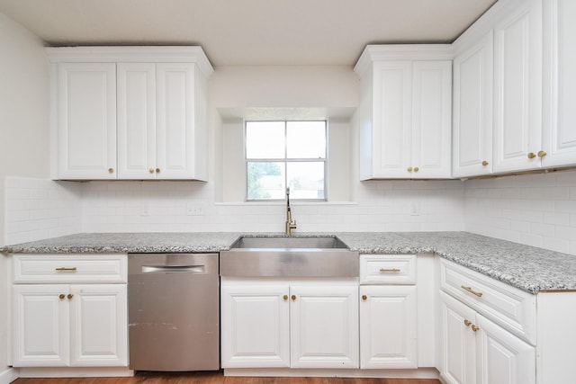 4618 Turf Valley Dr, Houston, TX 77084 - kitchen featuring dishwasher, a sink, white cabinetry, and decorative backsplash