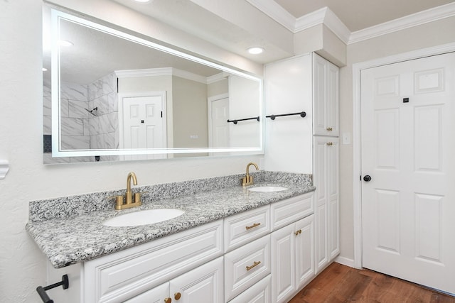 4618 Turf Valley Dr, Houston, TX 77084 - bathroom with ornamental molding, double vanity, wood finished floors, and tiled shower