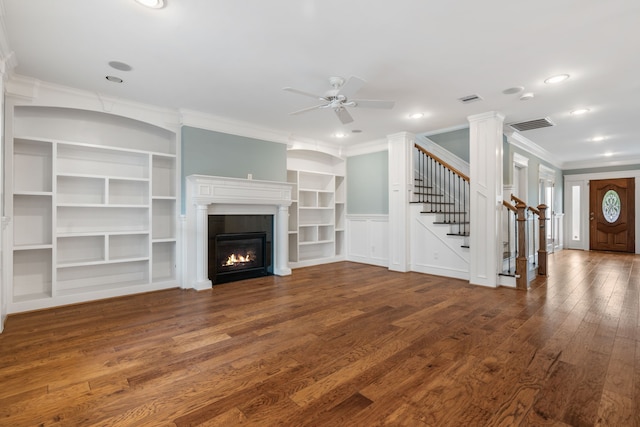 1510 Marshall St, Houston, TX 77006 - unfurnished living room with ornamental molding, ceiling fan, wood finished floors, stairs, and a glass covered fireplace