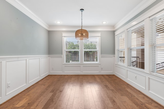 1510 Marshall St, Houston, TX 77006 - unfurnished dining area featuring light wood-style flooring, a decorative wall, ornamental molding, a wainscoted wall, and recessed lighting