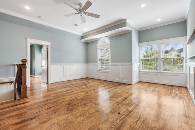 1510 Marshall St, Houston, TX 77006 - spare room featuring crown molding, wainscoting, light wood-style flooring, a ceiling fan, and recessed lighting