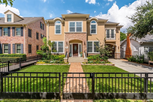 1510 Marshall St, Houston, TX 77006 - view of front of property featuring stucco siding, driveway, and stone siding