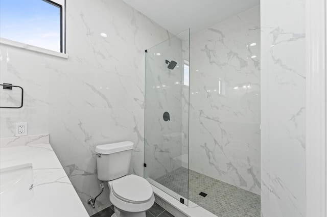 10070 Cedardale Dr, Houston, TX 77055 - bathroom featuring toilet, a marble finish shower, vanity, and tile walls