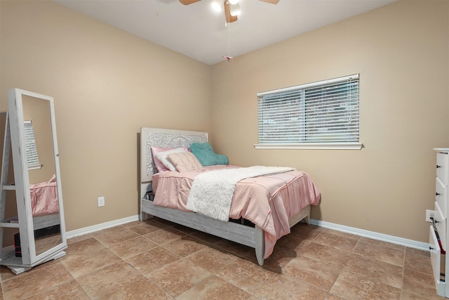 1027 Nantucket St, Pasadena, TX 77503 - bedroom with baseboards, ceiling fan, and light stone finish floors