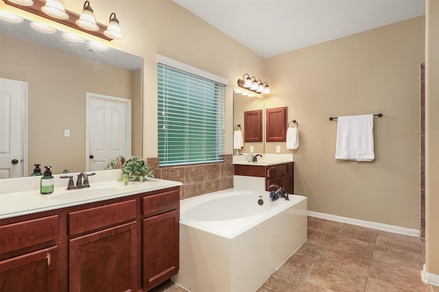 1027 Nantucket St, Pasadena, TX 77503 - full bathroom with a bath, vanity, and baseboards