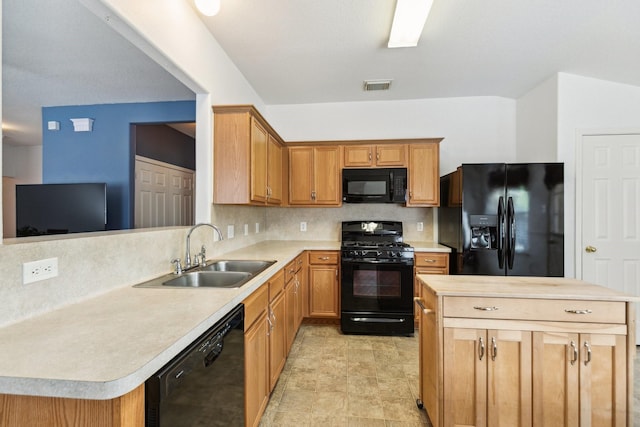 19119 Mossy Hedge Ln, Katy, TX 77449 - kitchen featuring black appliances, a sink, backsplash, and a center island