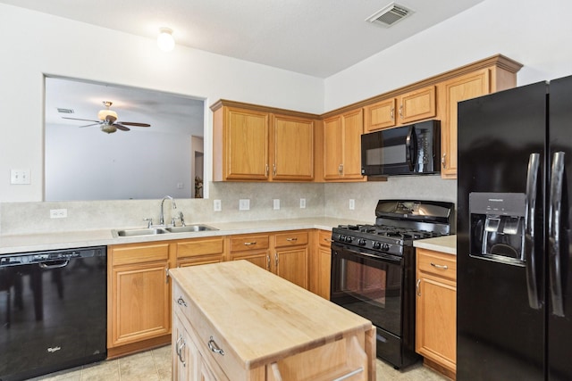 19119 Mossy Hedge Ln, Katy, TX 77449 - kitchen featuring black appliances, a sink, a ceiling fan, decorative backsplash, and butcher block countertops