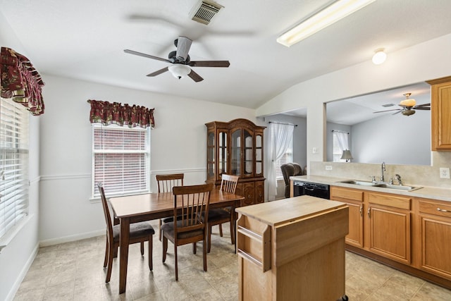 19119 Mossy Hedge Ln, Katy, TX 77449 - kitchen with ceiling fan, a sink, a kitchen island, healthy amount of natural light, and vaulted ceiling