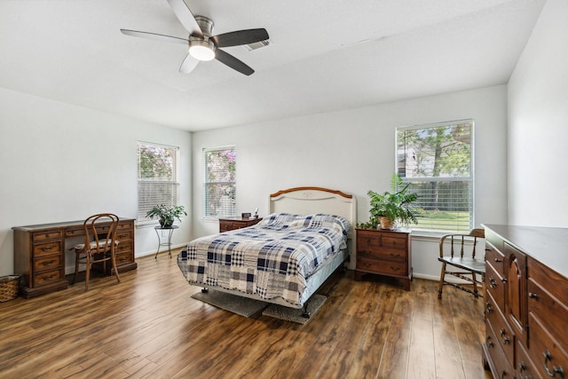 19119 Mossy Hedge Ln, Katy, TX 77449 - bedroom with wood finished floors, ceiling fan, and baseboards