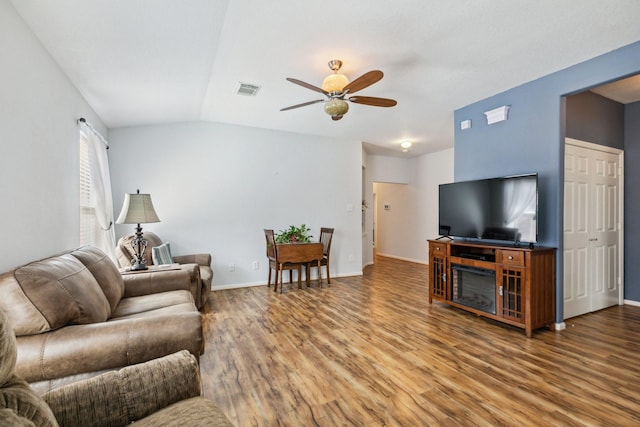 19119 Mossy Hedge Ln, Katy, TX 77449 - living room with a ceiling fan, wood finished floors, baseboards, and lofted ceiling