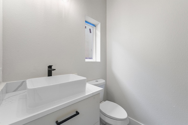 1932 Purswell Rd, Houston, TX 77055 - bathroom with toilet, vanity, and a textured wall