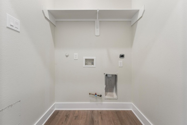 1932 Purswell Rd, Houston, TX 77055 - laundry room featuring gas dryer hookup, hookup for a washing machine, dark wood-type flooring, electric dryer hookup, and baseboards