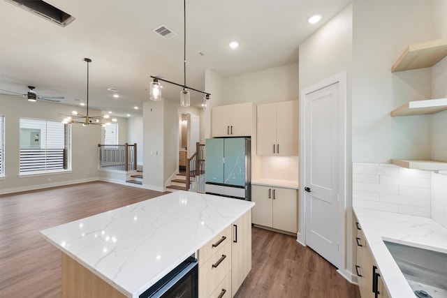 1932 Purswell Rd, Houston, TX 77055 - kitchen with freestanding refrigerator, open shelves, beverage cooler, light wood finished floors, and decorative backsplash