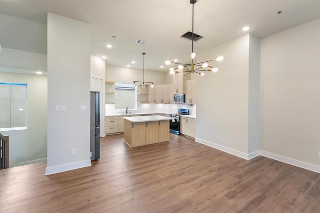 1932 Purswell Rd, Houston, TX 77055 - kitchen featuring stainless steel appliances, a center island, open shelves, a sink, and a chandelier