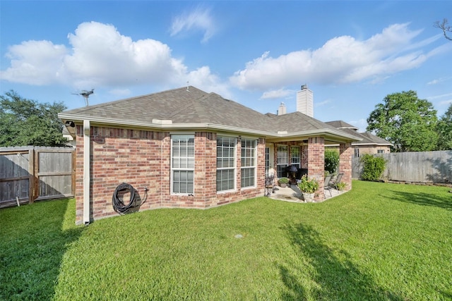 20688 Oakhurst Meadows Dr, Porter, TX 77365 - rear view of house with a chimney, brick siding, a patio, and a shingled roof