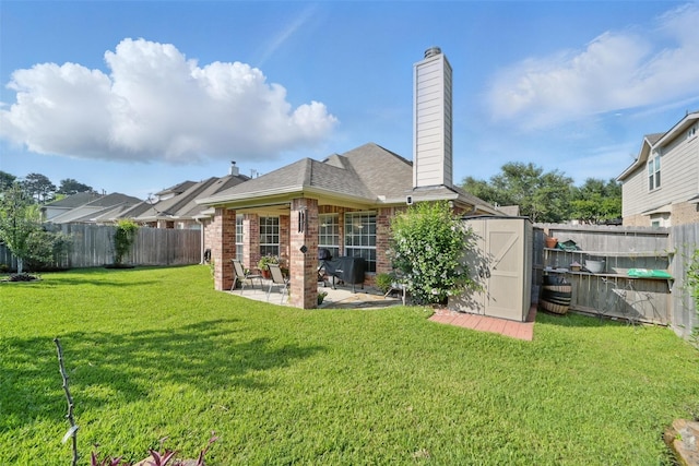 20688 Oakhurst Meadows Dr, Porter, TX 77365 - rear view of property with brick siding, a patio, a chimney, and a shingled roof