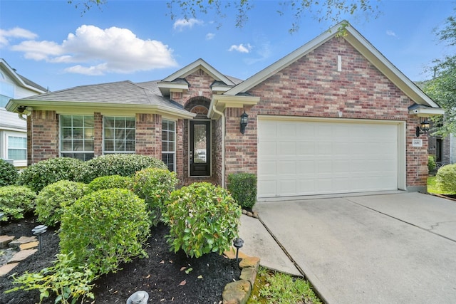20688 Oakhurst Meadows Dr, Porter, TX 77365 - view of front facade featuring a garage, brick siding, and concrete driveway