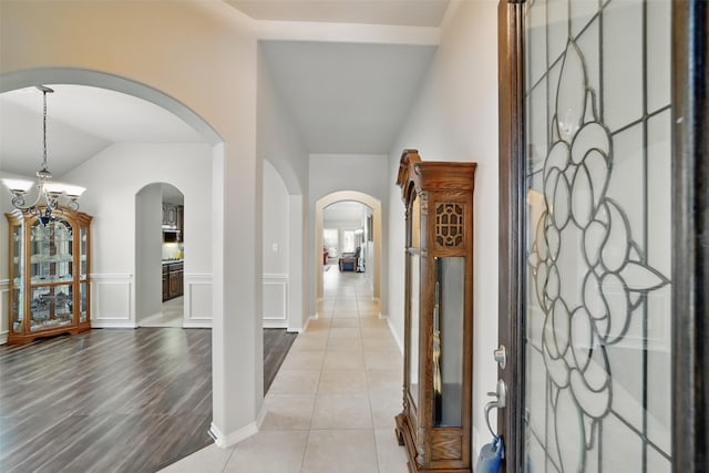 20688 Oakhurst Meadows Dr, Porter, TX 77365 - entryway featuring arched walkways, lofted ceiling, and light tile patterned floors