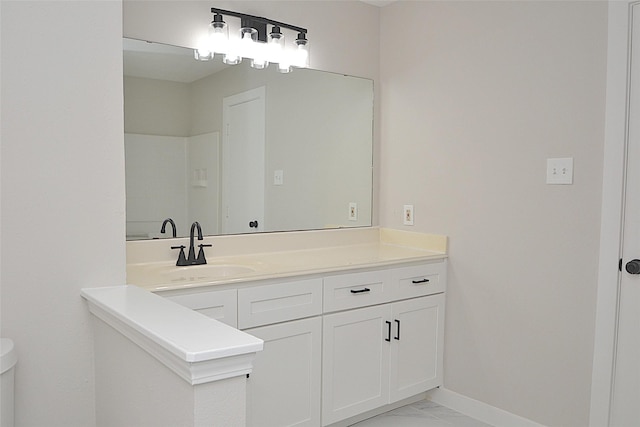 631 Aweigh Dr, Crosby, TX 77532 - bathroom featuring vanity, marble finish flooring, toilet, and baseboards