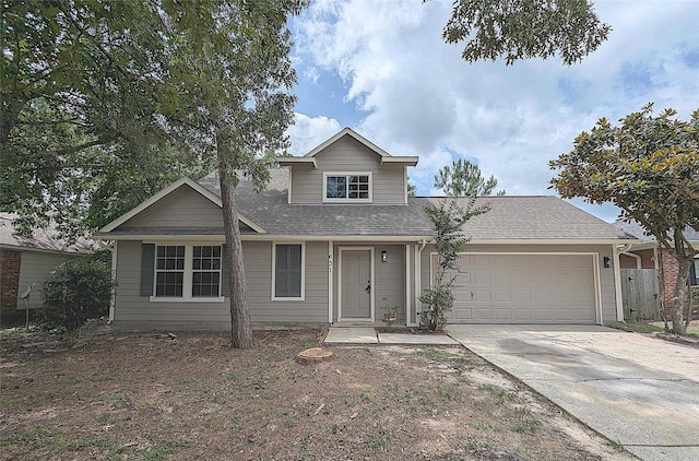 631 Aweigh Dr, Crosby, TX 77532 - traditional-style home with an attached garage, concrete driveway, and a shingled roof